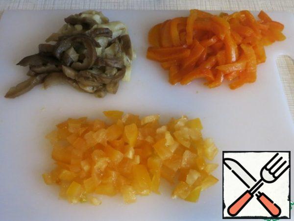 Baked vegetables (peppers and eggplants), peel, cut into strips, tomato cubes.
