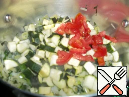 Add zucchini, tomato, garlic.