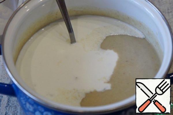 Stir in cream or milk, reheat if necessary.