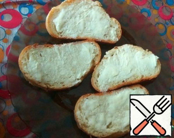 Brush the bread with butter.
