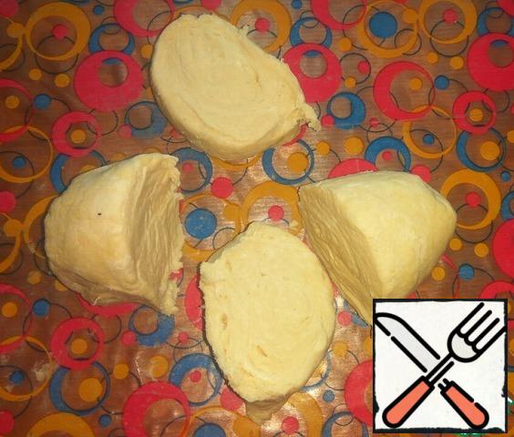 Remove dough from refrigerator, punch down couple of times and divide into 4 equal parts.