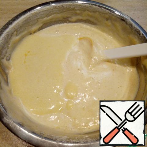 Pour the butter mixture from the edge of the bowl and stir in the same gentle movements in one direction.
The batter should be airy, light, smooth.