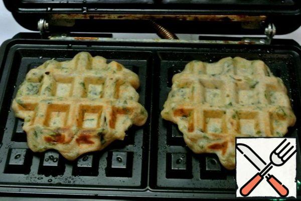 Bake for 5 minutes. Ready-made waffles to serve with balls of spicy curds.