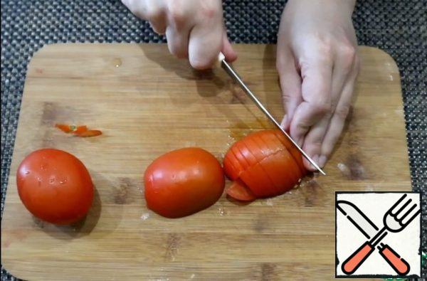 Tomatoes cut into quarters.