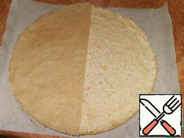 Carefully remove it from the mold and remove the parchment. The bottom of the cake should also be dry!