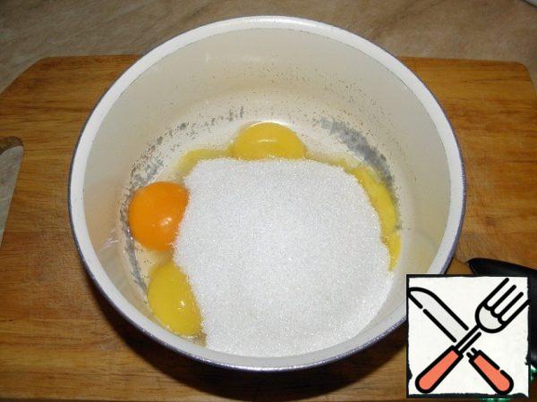 Mix yolks with sugar.