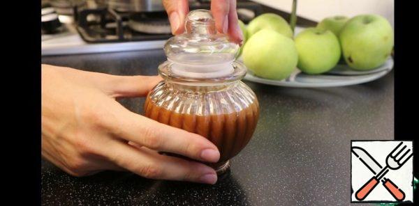 Give a little cool, and pour into a jar, which will store.
After it rises in the refrigerator, caramel is even better.