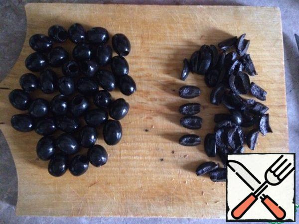 Olives cut into four parts (in half and in half again), can be six parts.