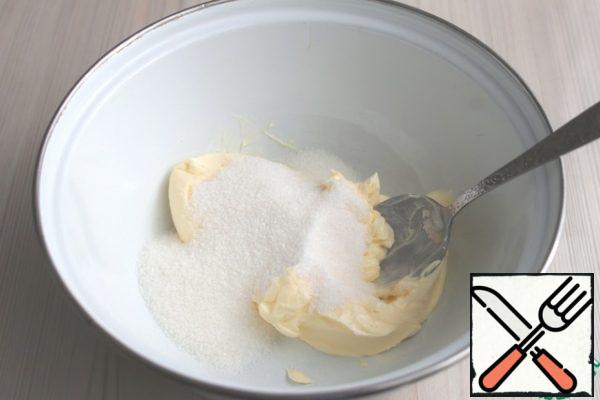 In a bowl, add softened butter (180 gr.), pour 1/2 cup of sugar. Rub the butter with sugar.
