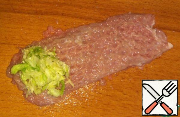The layer of meat put a bit of cabbage.
