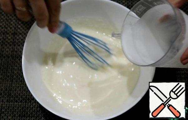 In a bowl, mix eggs, salt, sugar. Then pour the yogurt and mix.