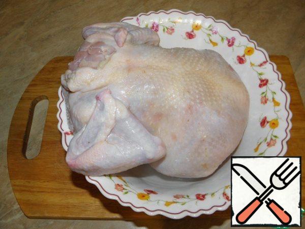 Pour boiling water over the chicken carcass!