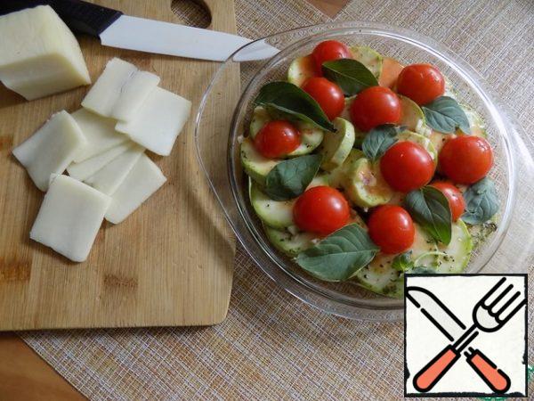 Spread the cherry on top of zucchini, pour the diluted sauce. I cut mozzarella into thin slices. Perfect mozzarella balls. 