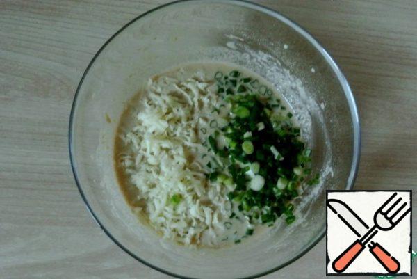 Add grated cheese and chopped green onions.