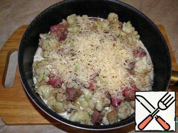 Grate the cheese (I like it small) and add it to the dish too.
