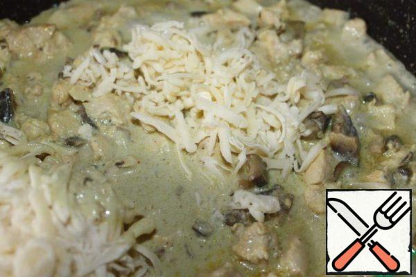 Next - sour cream, stew all together for a few minutes, and grated cheese at the end.