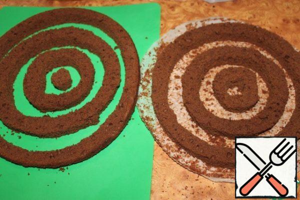Thus, the biscuit should be divided into two parts consisting of several circles.
