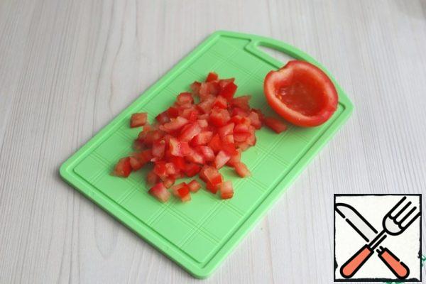 Cut the tomato cups into small cubes.
