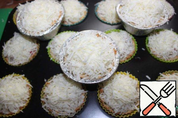 Sprinkle the remaining mozzarella on top. Put back in the oven for 10 minutes at 180-200 degrees.