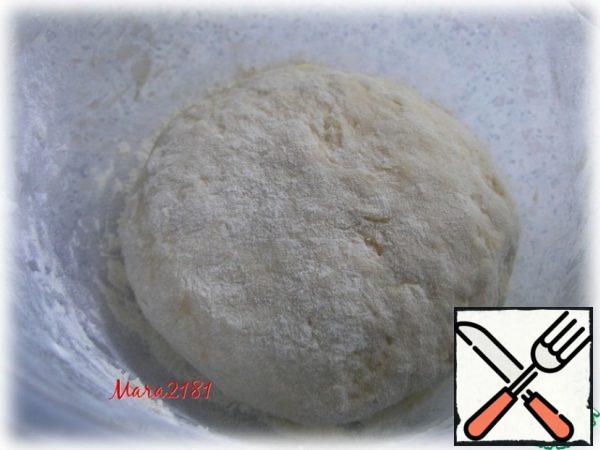 When the dough is almost ready and does not stick to your hands, add 1 tsp soda and knead well again. The dough wrap with cling film and send to the refrigerator for half an hour.