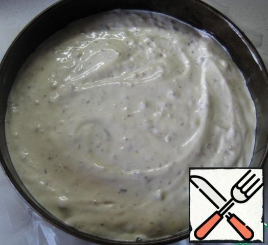 Spread the dough in a form (diameter 20 cm, pre-bottom laid parchment and lightly greased bumpers with vegetable oil) and set to bake in a preheated 180 degree oven for 50-55 minutes, check the readiness of a wooden skewer.