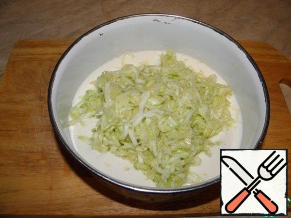 Squeeze the zucchini well and add to the cheese-egg mixture.
