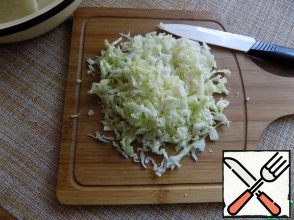 Very finely chop the cabbage.