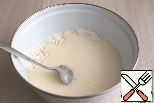 Combine a mixture of dry ingredients and egg - sugar mixture.
