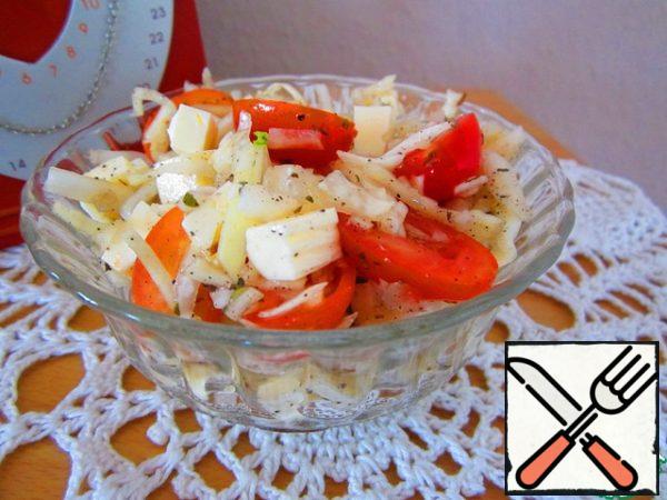 Mix cabbage, tomatoes, spices, garlic, add cheese, season with vegetables, and the salad is ready.

For lovers of sour: with lemon juice, this salad is also very tasty.
Note: If you have fresh basil, you can add more. 3-5 leaflets are the very thing.