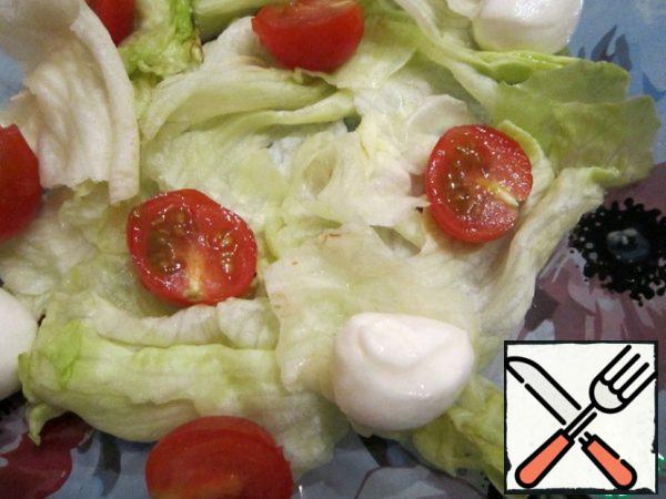 Cheese cut into slices.
Mix with salad and cut into halves cherry tomatoes.