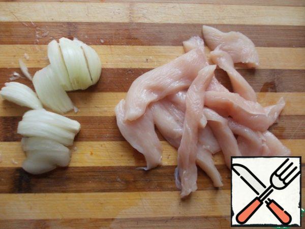 Cut the breast into strips and onions as well.