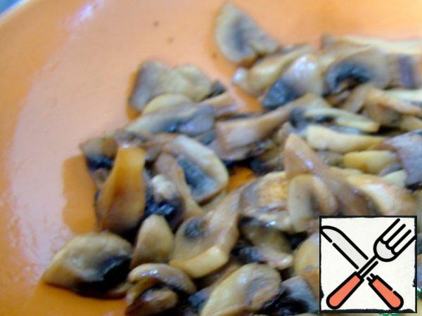 Mushrooms cut into small slices and also fry until tender.