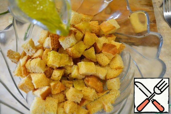 Pour the dressing over the hot cookies and mix.
