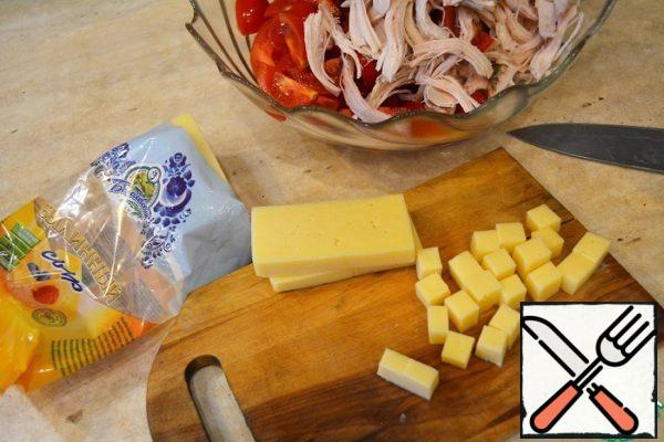 Cut the cheese into cubes.
