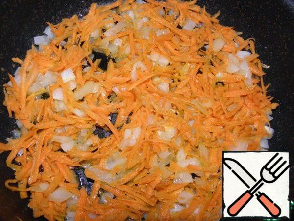 Add grated carrots and fry until soft .