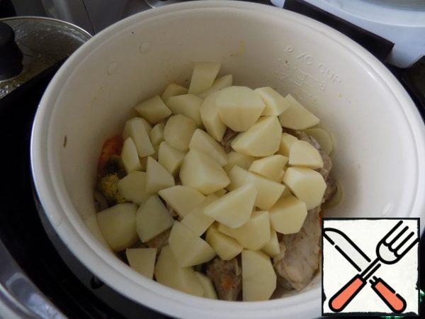 Spread potatoes, chopped coarsely.
