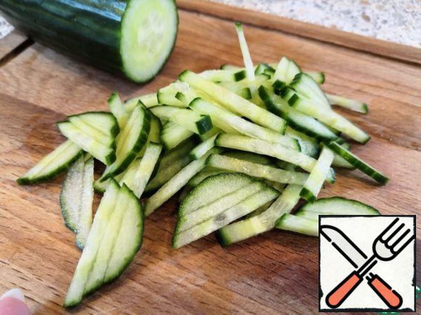Chop the cucumber into strips.