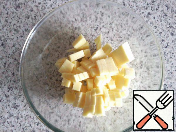 At this time, cut into cubes:
- cheese;
