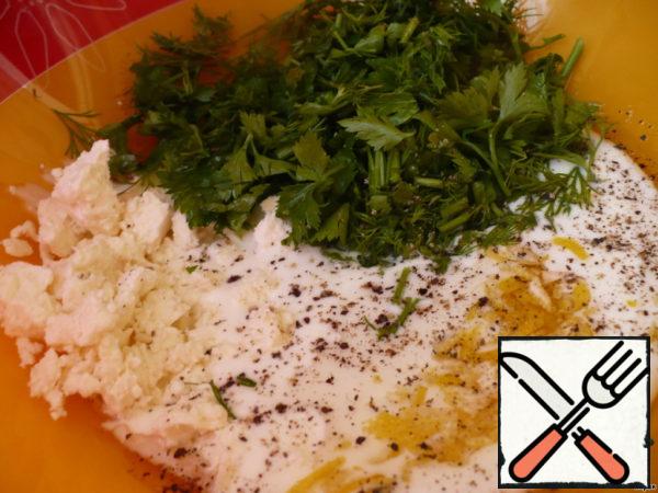 Mix butter, zest, chopped herbs, yogurt and crumbled cheese in a deep bowl. Add pepper.

