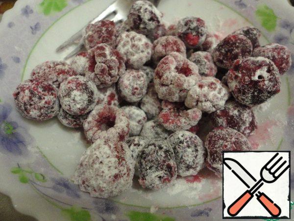 Roll the berries in powdered sugar.