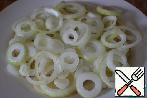 Onions cut into slices. To peel back the layers and spread on top of potatoes.