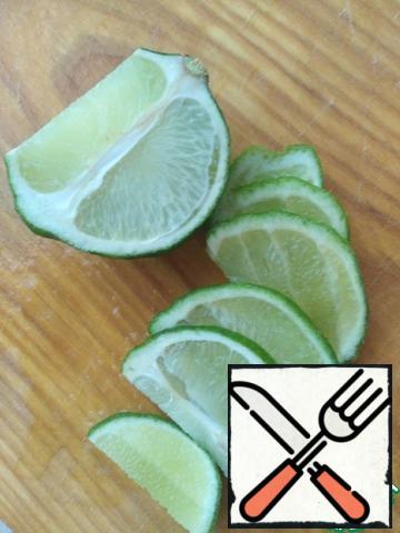 Lime cut in half. Cut one half into slices and squeeze the juice from the other half.
