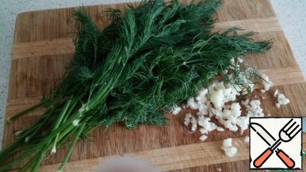 While the eggplants are baking, chop the garlic and herbs.

