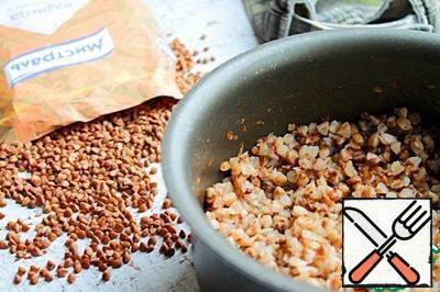 Boil buckwheat in salted water until tender. Buckwheat should remain crumbly.