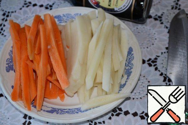 Potatoes and carrots cut into cubes.