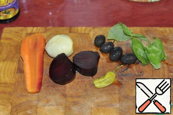 Cut the vegetables into small segments. olives green and black, if they giant can cut in half if small leave whole, well, or as you like.