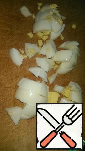 Eggs boil and cut into cubes.