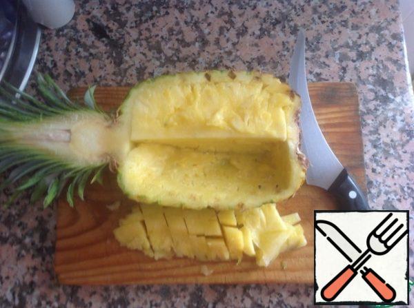 Half pineapple peel and cut into slices.