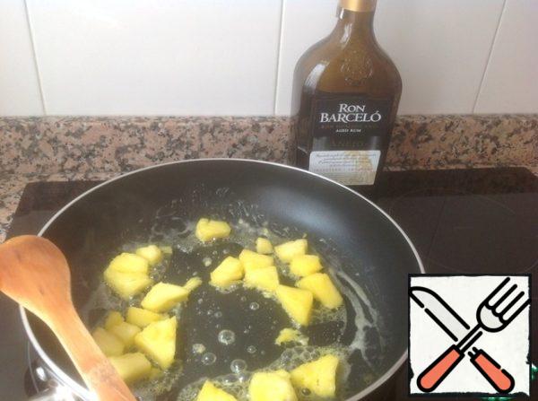 Add 1 tablespoon of rum and flambé ( burn to evaporate alcohol).