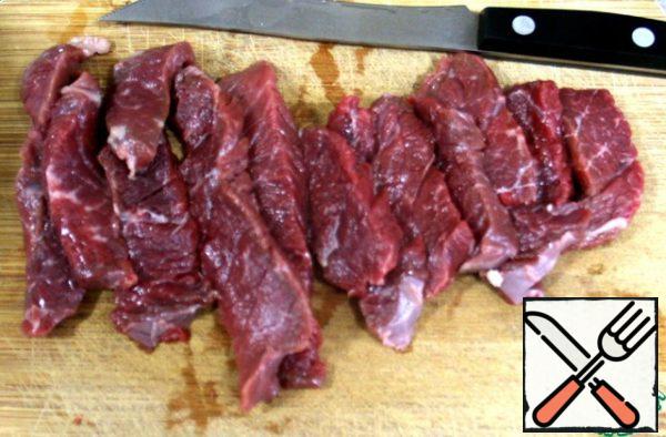 Beef cut into thin small strips.